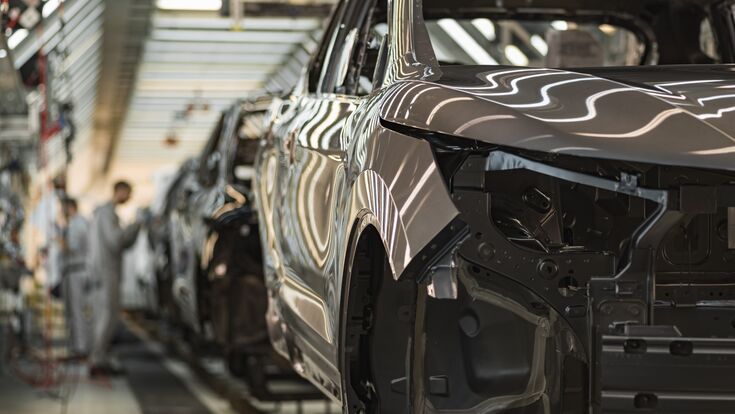 © vadimalekcandr - stock.adobe.com Production line of automobile plant, paint shop, conveyor. Finished product