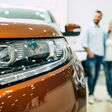 car couple buying new dealership young buy beautiful people smiling woman happy family caucasian customer transportation retail vehicle automobile choosing business adult white sales happiness showroom industry men rental looking key keys man female male human love cheerful two purchase indoors service owner transport shop selling automotive holding person camera