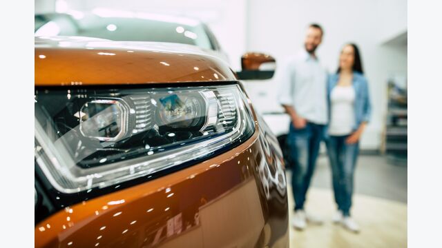 car couple buying new dealership young buy beautiful people smiling woman happy family caucasian customer transportation retail vehicle automobile choosing business adult white sales happiness showroom industry men rental looking key keys man female male human love cheerful two purchase indoors service owner transport shop selling automotive holding person camera
