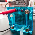fuel cell hydrogen prototype water battery electrical cells energy power industry electricity alternative accumulator clean supply device chemical reaction ions oxygen oxidizing air electromotive force pem proton exchange membrane h2 o2 electronics lab laboratory design nanotechnology technology equipment part engineering chip science technician close-up work environment effect save electric green modern